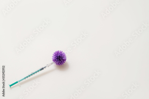 syringes on the table with bacteria of coronavirus, bacterium injection © denisval