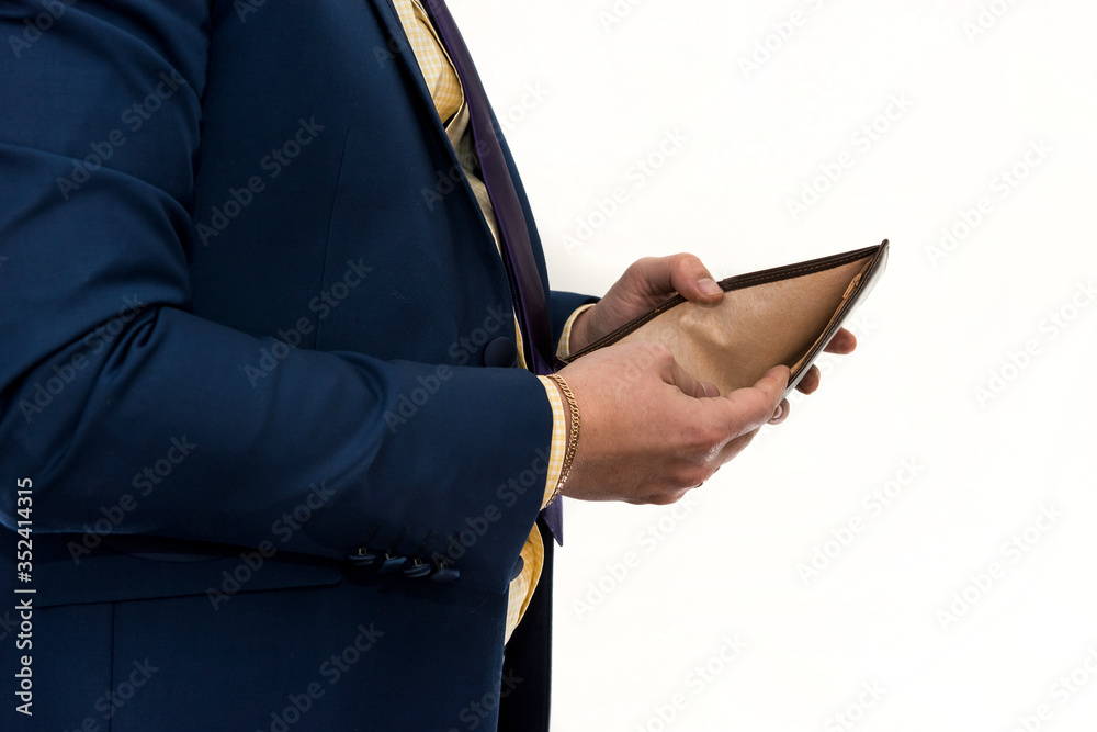 Businessman holding an empty wallet. Despair and failure. Bankruptcy or poverty concept Businessman holding an empty wallet. Despair and failure. Bankruptcy or poverty concept