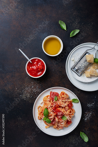 Traditional italian pasta with tomato, basil and parmesan