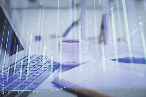 Double exposure of financial chart drawing and desktop with coffee and items on table background. Concept of forex market trading