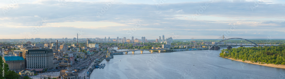 View of Podil district at sunset from New Pedestrian and Bicycle Bridge in Kyiv, Ukraine