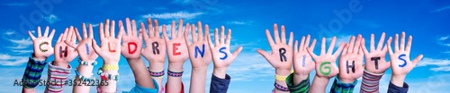 Children Hands Building Colorful English Word Children Rights. Blue Sky As Background photo