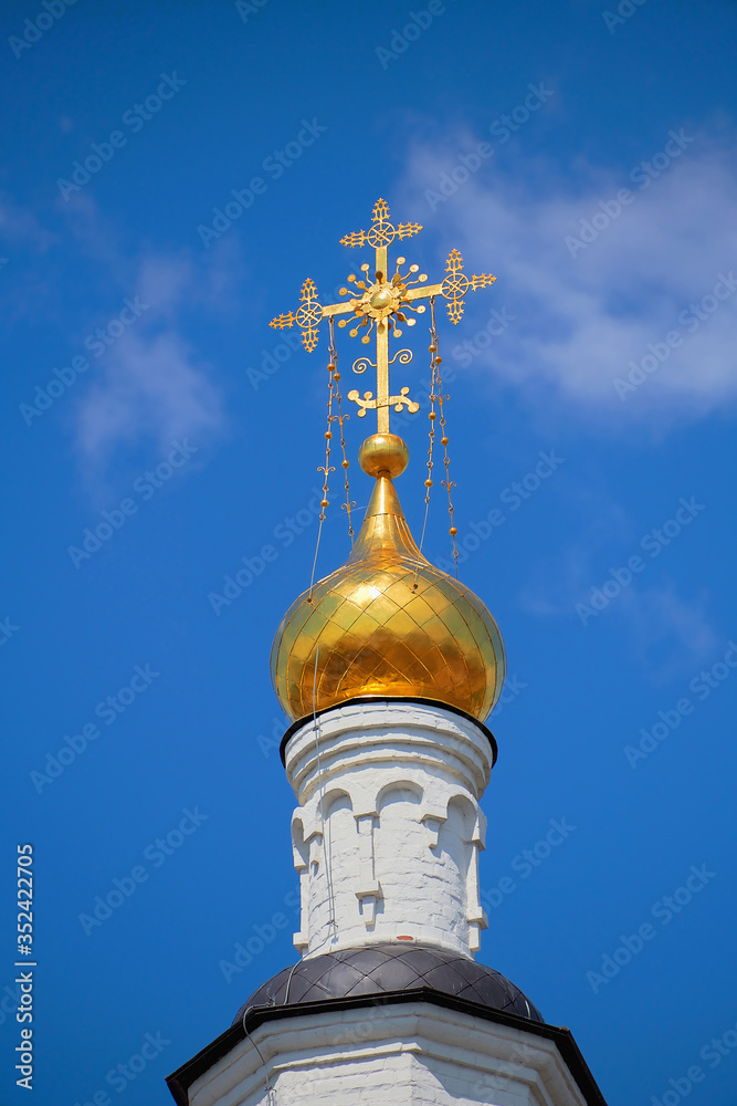 Golden dome of the Church with a cross in the monastery on the island of Sviyazhsk in Kazan. The monastery is protected by UNESCO. Golden dome of the Church with a cross in the monastery on the island of Sviyazhsk in Kazan. The monastery is protected by UNESCO.