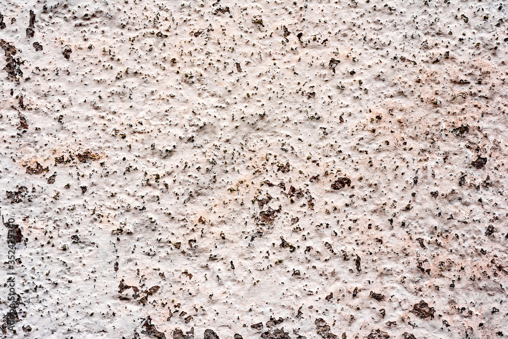 Texture of a concrete wall with cracks and scratches which can be used as a background Texture of a concrete wall with cracks and scratches which can be used as a background