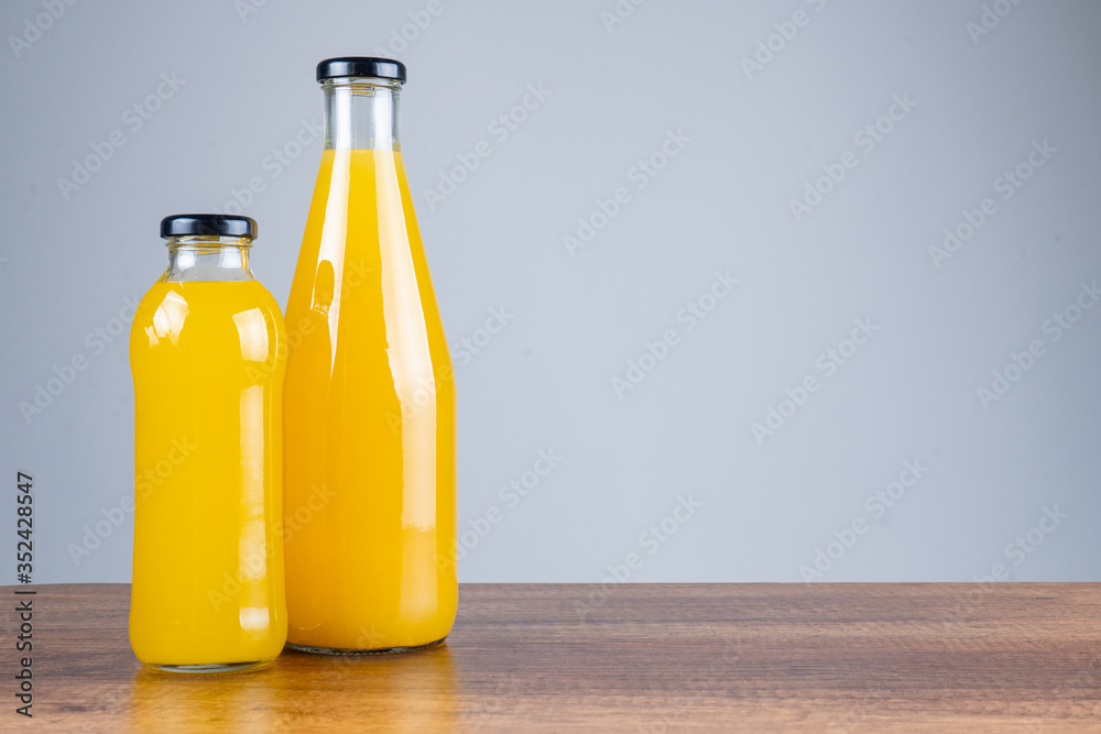 Bottle of orange juice and oranges Bottle of orange juice and oranges