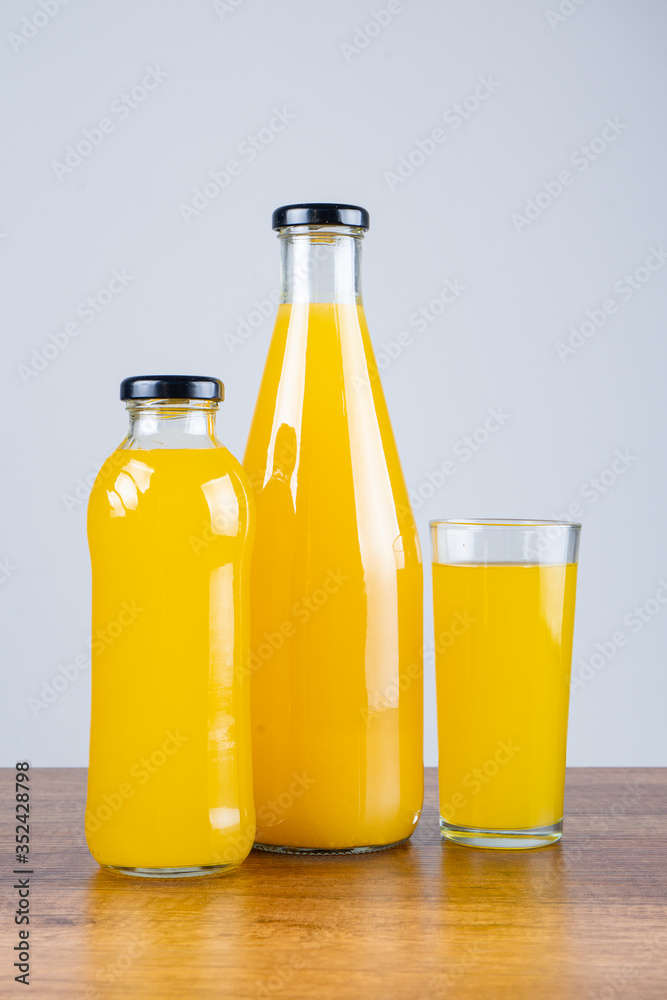 Bottle of orange juice and oranges Bottle of orange juice and oranges