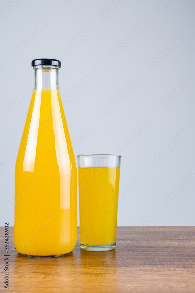 Bottle of orange juice and oranges Bottle of orange juice and oranges