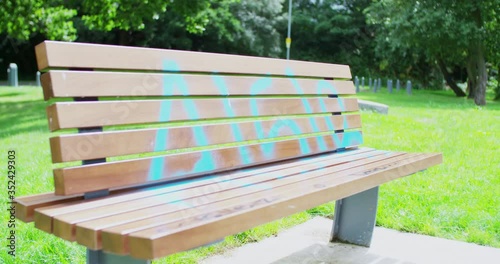 Pan of a summer seat with vandalised graffiti