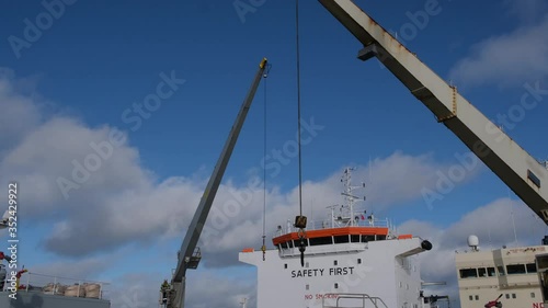 industrial Natig Aliev and Rina tankers cranes perform professional rigging operations on Skagen Danish port raid photo