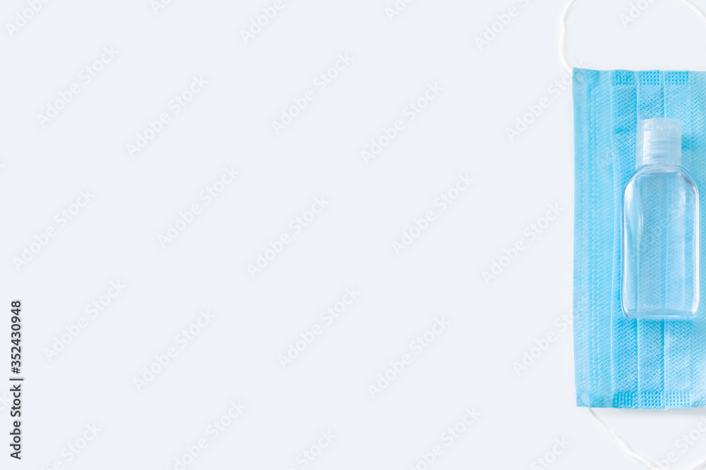 Medical face mask and hand sanitizer isolated Medical face mask and hand sanitizer isolated