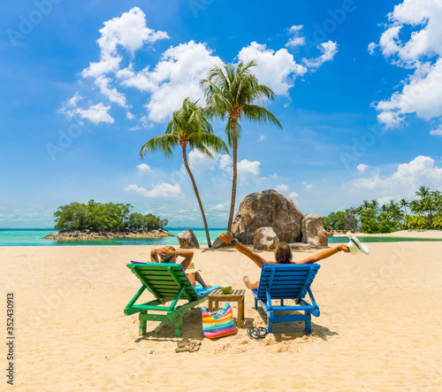  couple sitting and relaxing tropical the beach