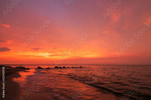 scenic seaside with blood red sky