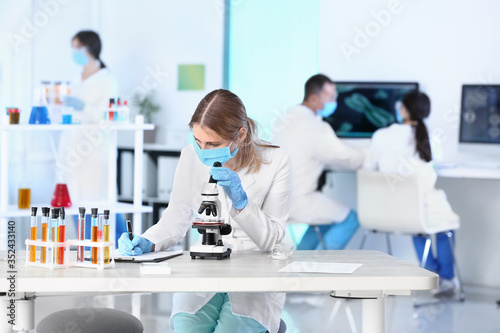 Scientist working with micr...