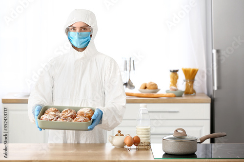 Woman in biohazard suit coo...