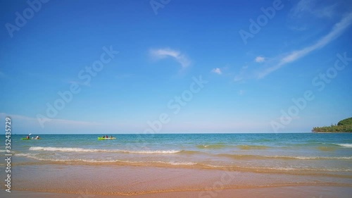 Tropical beach in Thailand, Beautiful beach waves with blue sky.