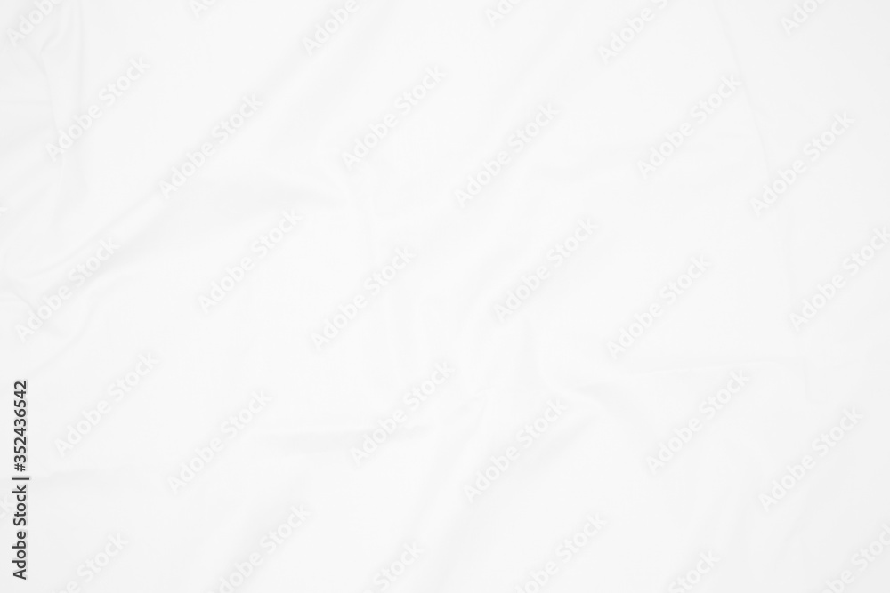 White  fabric cloth background abstract with soft waves , flowing draped cloth in rippled elegant curves and wrinkled creases , soft focus, textured background and abstract