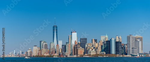 Wide panorama image of skyscrapers in Manhattan, New York at daytime