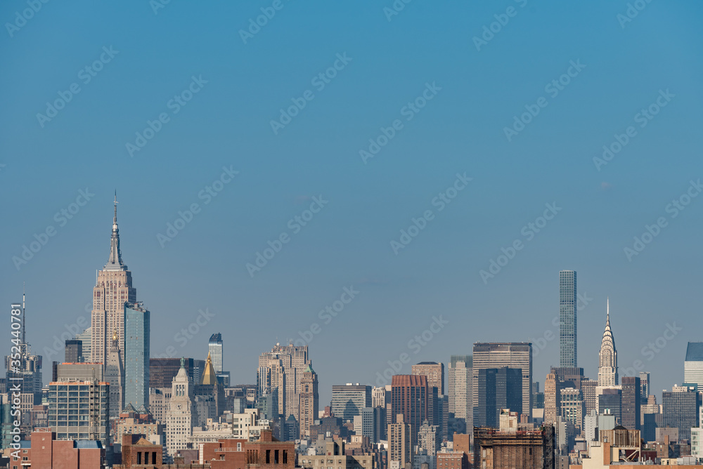 Wide panorama image of skyscrapers in Manhattan, New York at daytime