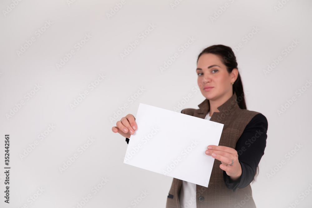young business woman showing blank sign board, over studio background isolated young business woman showing blank sign board, over studio background isolated