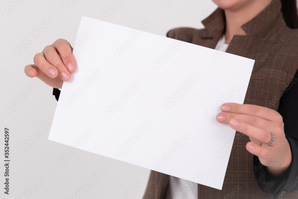 Obraz premium woman showing paper isolated over white background