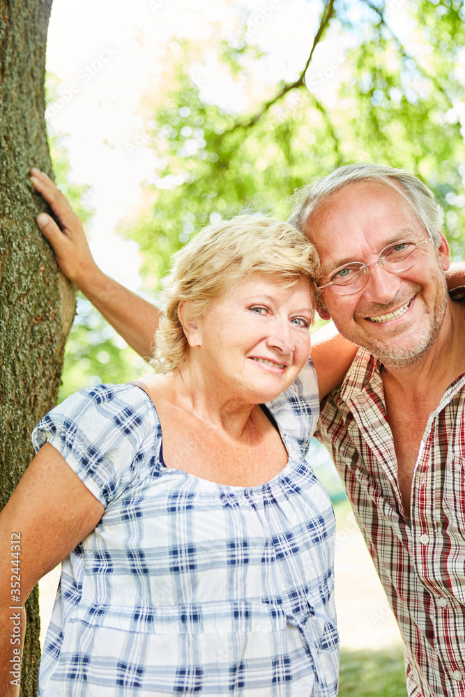 Amorous senior couple looks happy