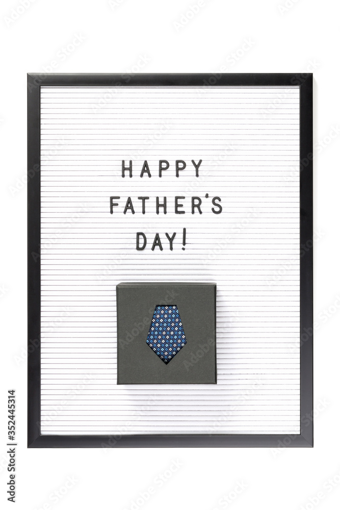 Happy Father's Day text on letter board with boxed dark blue tie isolated on white. Minimal framed text. Father's Day sale mockup template. Copy space Happy Father's Day text on letter board with boxed dark blue tie isolated on white. Minimal framed text. Father's Day sale mockup template. Copy space