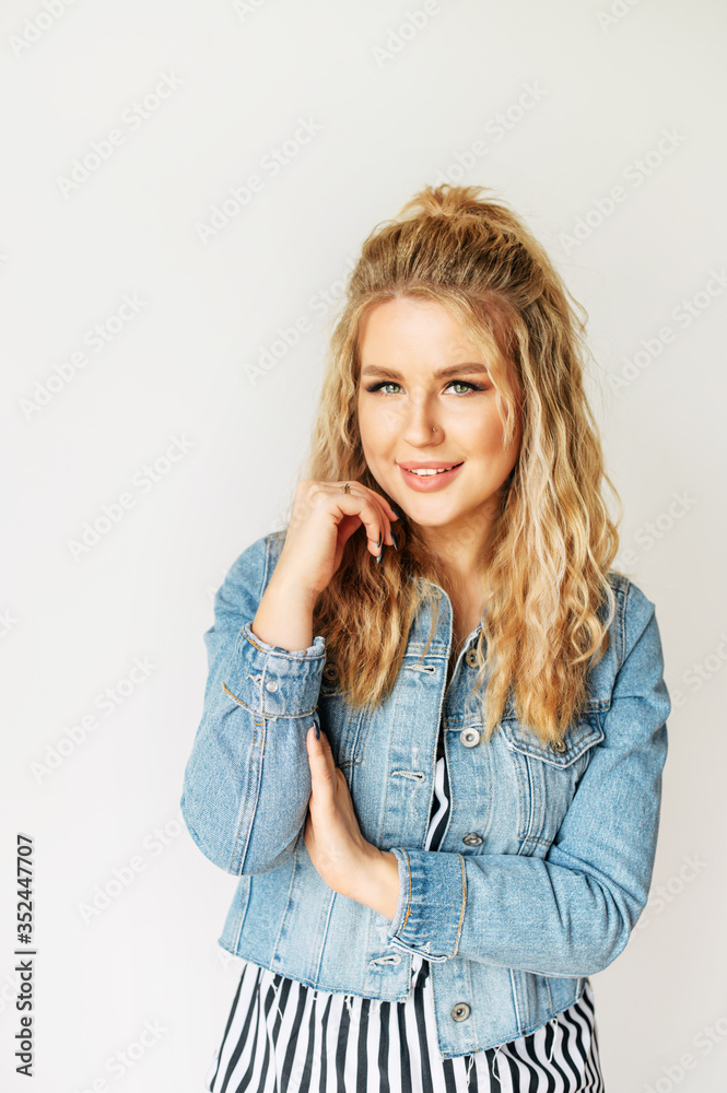 Portrait of cute blonde girl with a fresh face skin and trendy make-up on a white background. Portrait of cute blonde girl with a fresh face skin and trendy make-up on a white background.