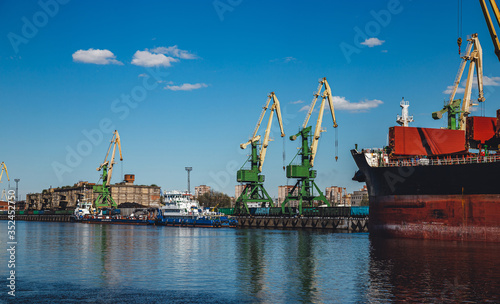 cargo cranes in a river port