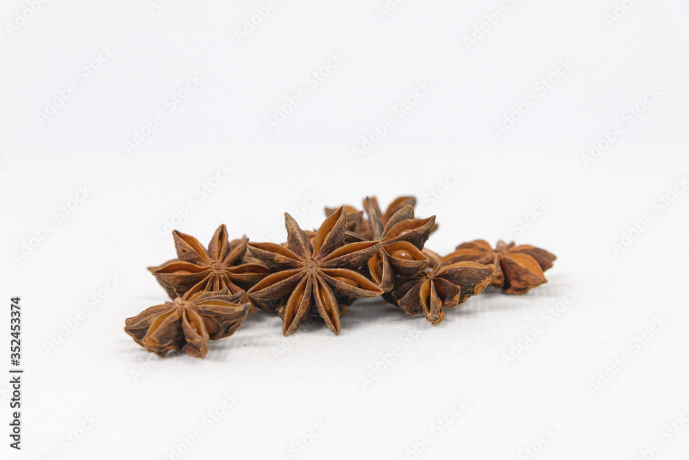 Star anise spice on white canvas background Star anise spice on white canvas background