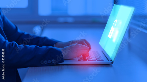 Businessman login on his computer. Multi exposure of lock icon on computer screen. Privacy Security Protection Concept photo