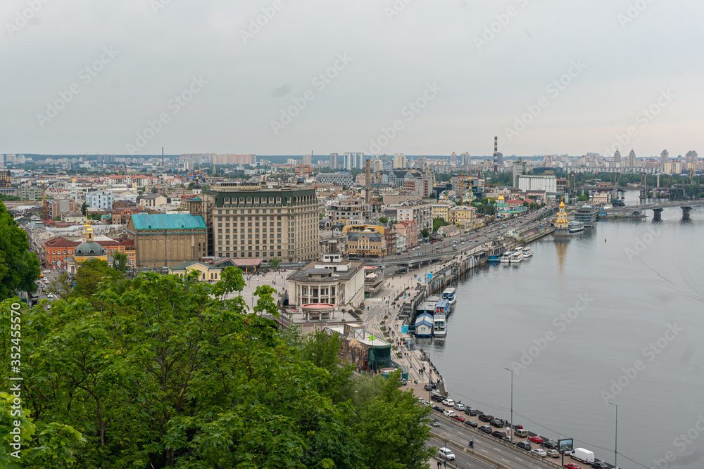 A beatiful view on the center of Kyiv, business and residential buildings, nature in the city, bridge and Dniepr river