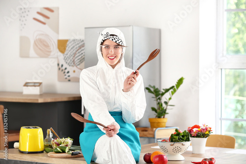 Housewife in protective cos...