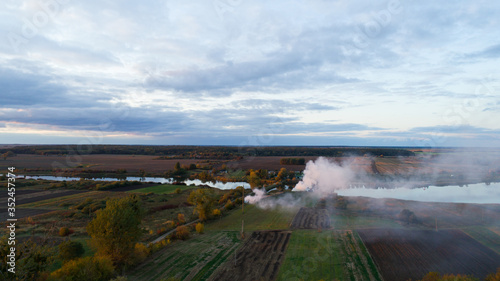 smoke in the field. aerial view