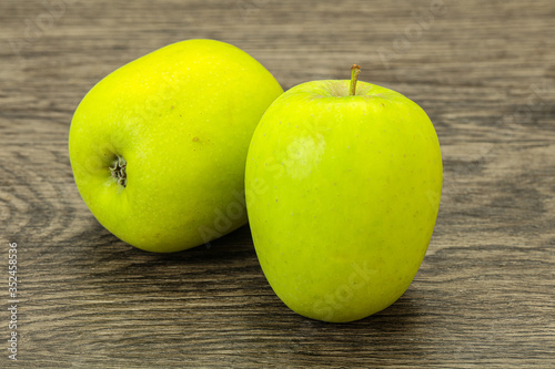 Two ripe green sweet apples