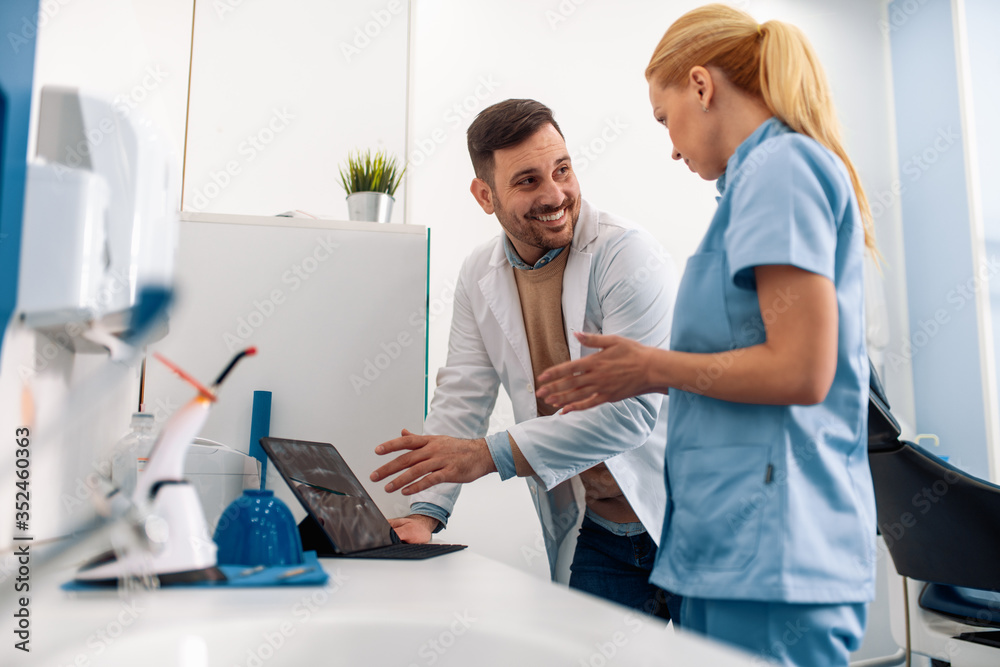 Image of two doctors looking at x-ray. Image of two doctors looking at x-ray.