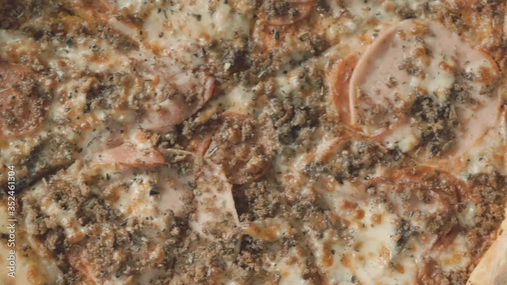 Close up of Appetizing Pizza with Spices, Herbs, Fresh Vegetables, Tomato Sauce. Italian Food, Melted Cheese. Hot Pizza in cardboard box. Top view about Pizza. Close up of Appetizing Pizza with Spices, Herbs, Fresh Vegetables, Tomato Sauce. Italian Food, Melted Cheese. Hot Pizza in cardboard box. Top view about Pizza.