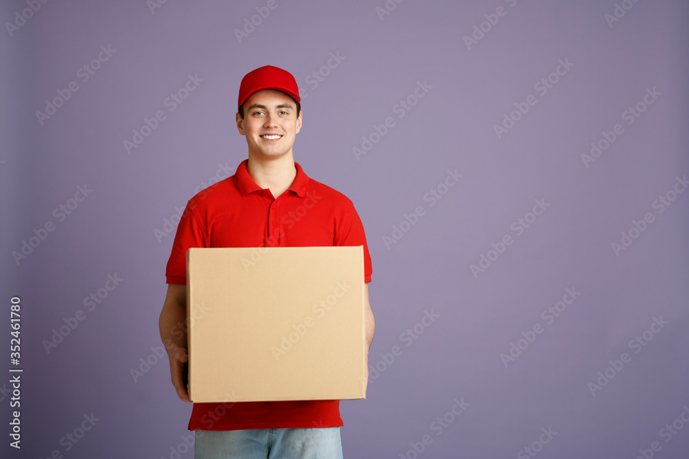 Fast delivery and big parcel. Caucasian post worker gives out big box Fast delivery and big parcel. Caucasian post worker gives out big box
