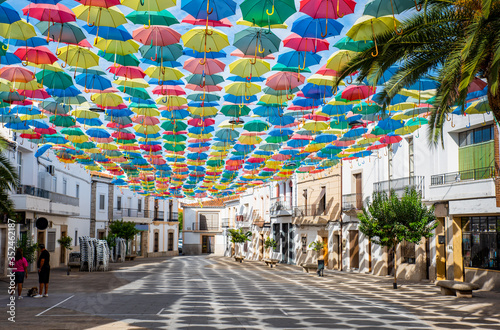 Umbrellas floating in the sky with lots of color in Águeda, Portugal
