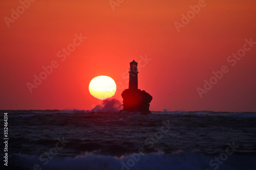 Sunrise at the lighthouse of Tourlitis , Andros , Greece