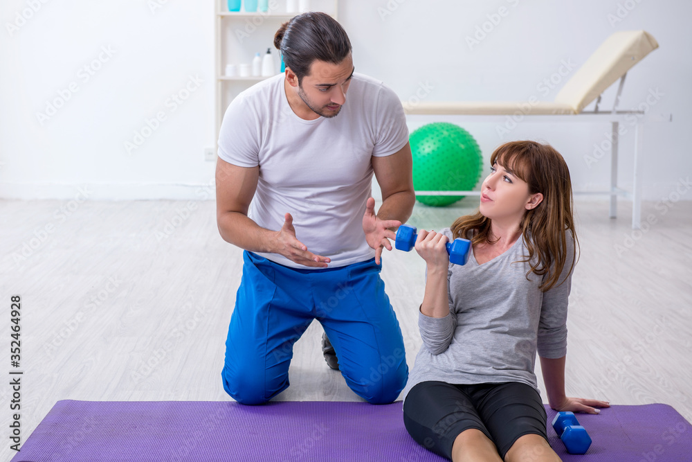 Young woman doing sport exercises with personal coach Young woman doing sport exercises with personal coach