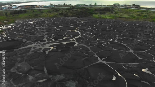 Amazing aerial of the pitch lake, the largest natural deposit of asphalt in the world located in la Brea, Trinidad photo