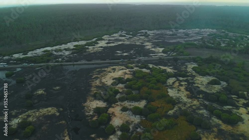 Aerial view of an access road during a severe dry season which cause the waters of the wetland to dry up photo