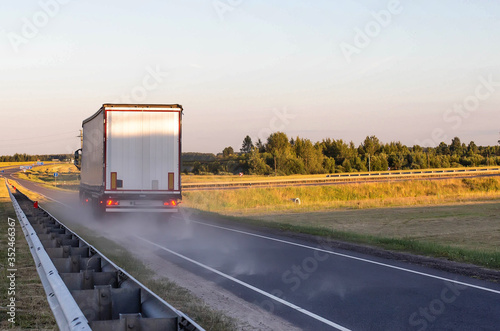 Emergency braking of a loaded truck on dry asphalt. Safety concept and stopping distance with ABS, copy space