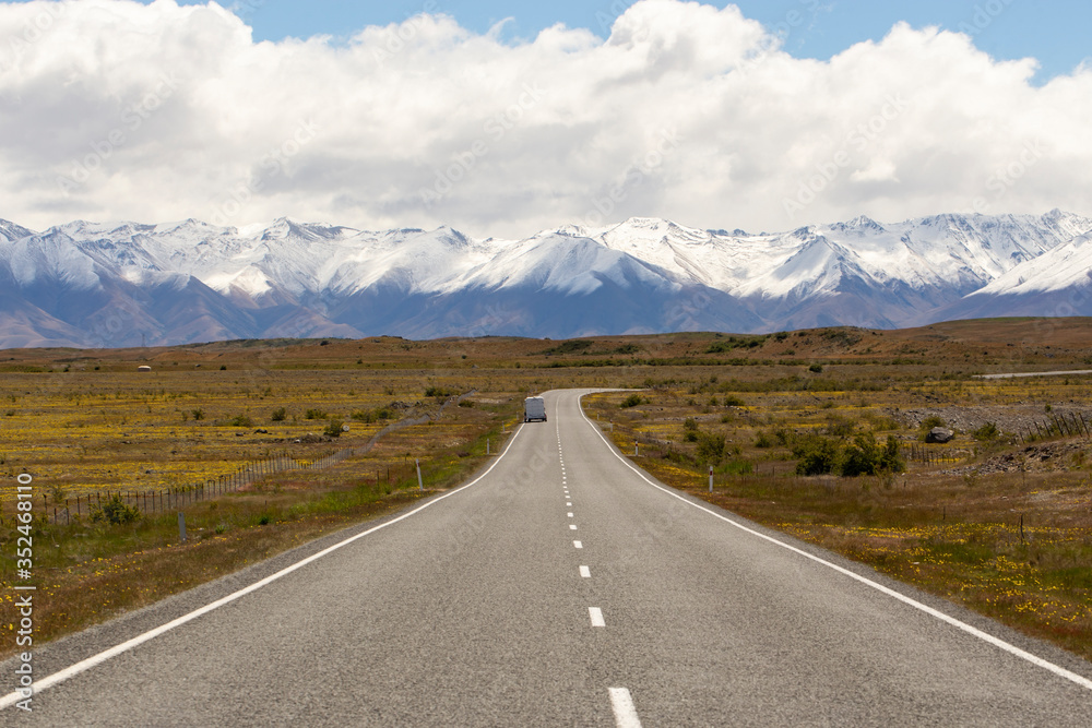 Beautiful landscape of car, road and snow mountain in South Island, New Zealand 