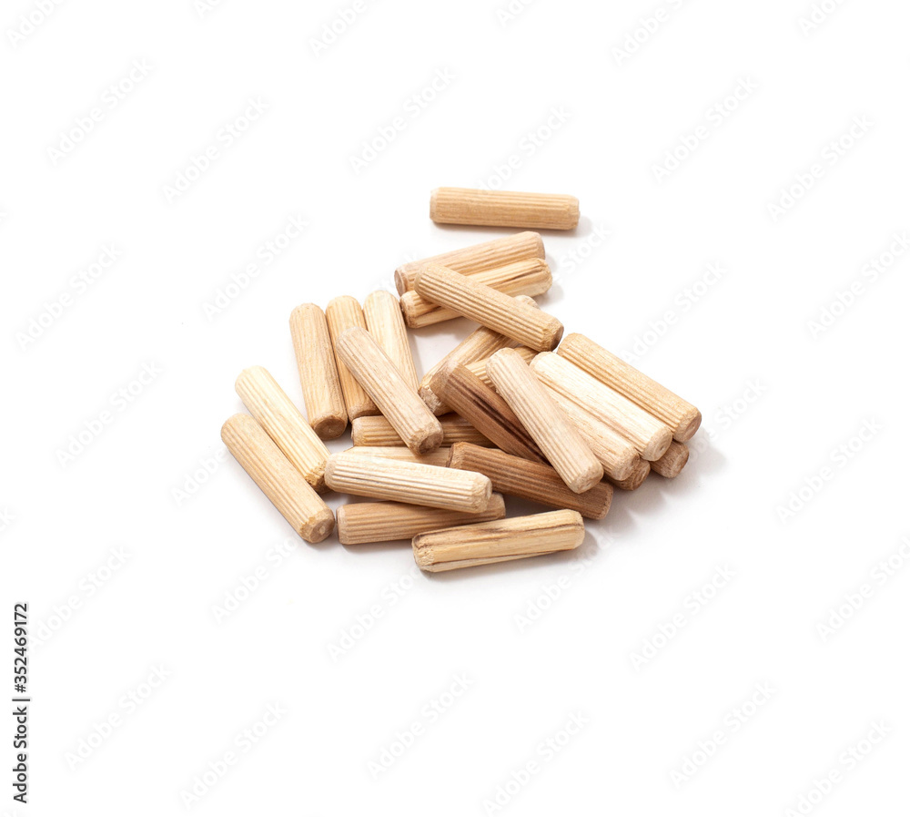 wooden dowel for assembling furniture on a white background, isolate, close-up wooden dowel for assembling furniture on a white background, isolate, close-up