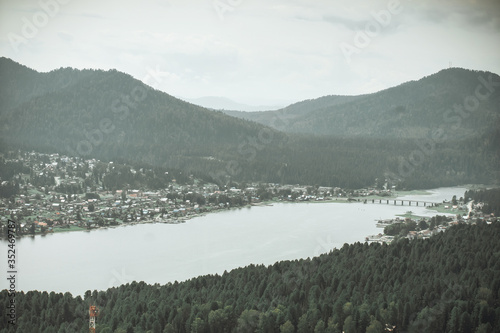 View from mountain on Teletskoye lake in Altai mountains, Siberia, Russia. Panorama of lake. Beauty summer day.