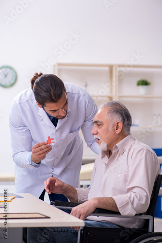 Doctor and patient suffering from Alzheimer disease