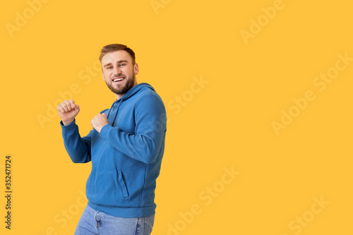 Handsome young man dancing ...