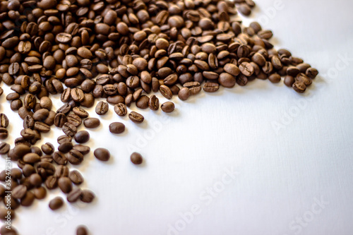 Coffee beans isolated on white background. Mixture of different kinds of coffee beans. Fresh rosted coffee beans on white background, space for text. Close-up.