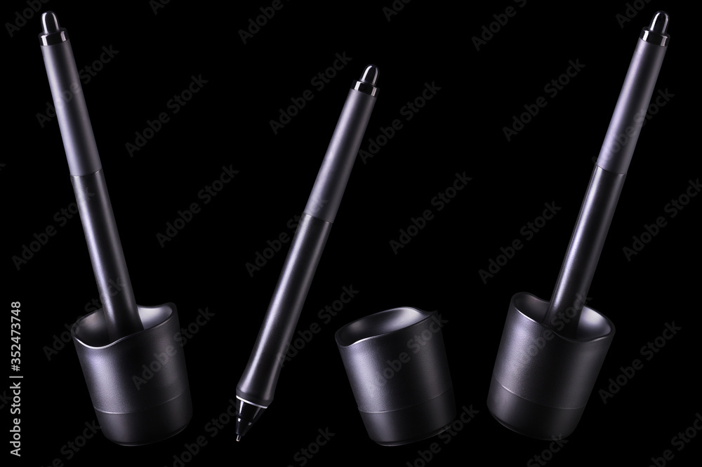 Set of digital graphic pen with stand isolated on black background Set of digital graphic pen with stand isolated on black background